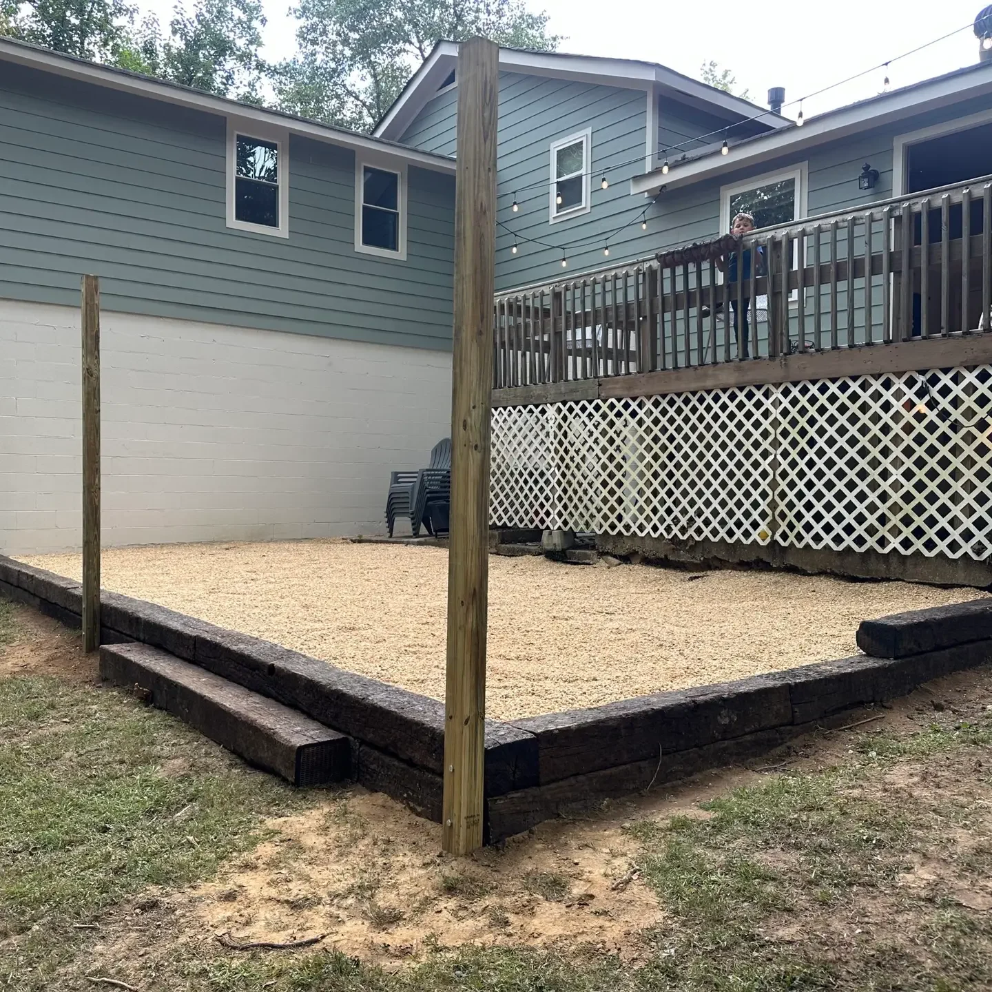 patio deck railroad ties gravel landscaping