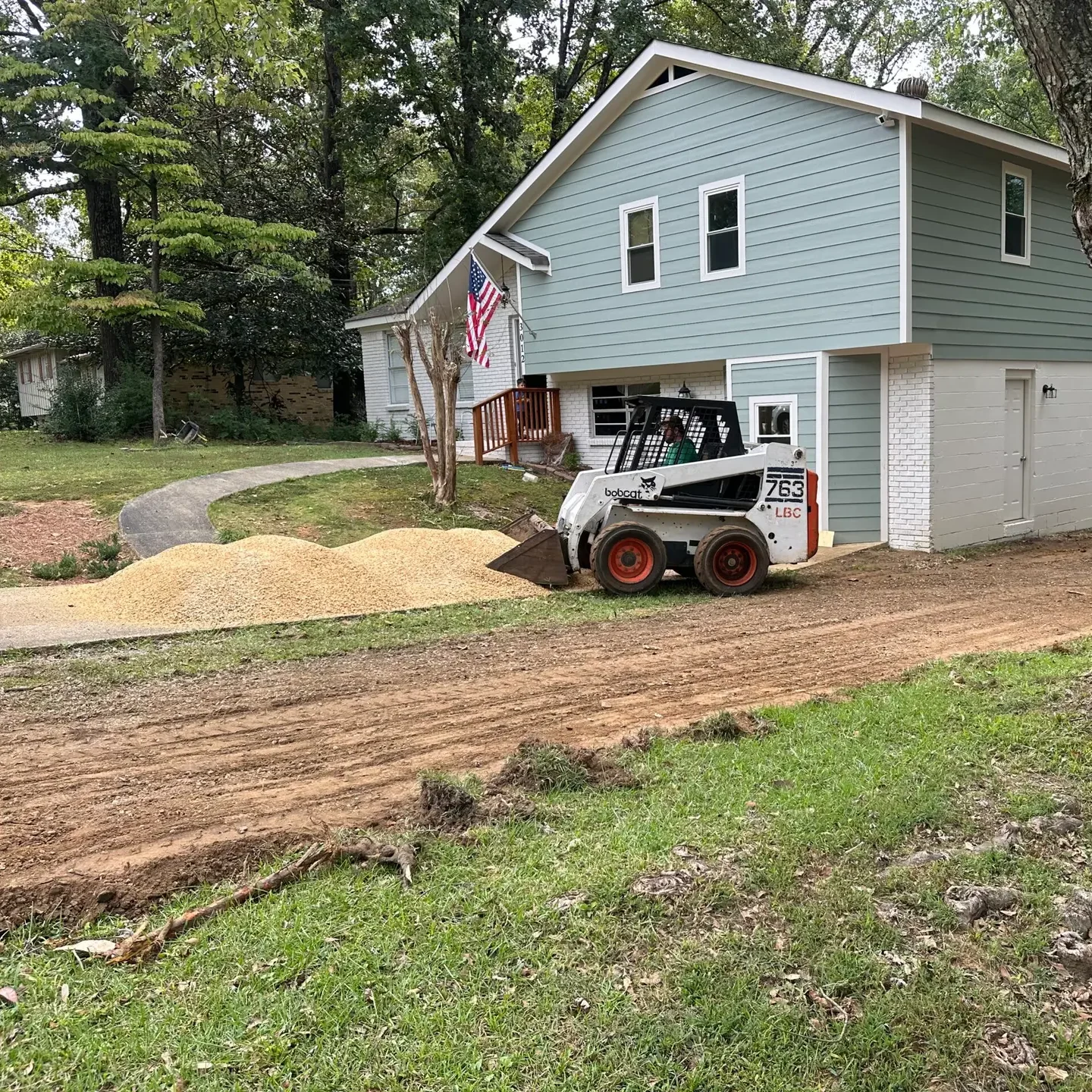 Skid steer service work at residential home bobcat landscaping dirt gravel rock